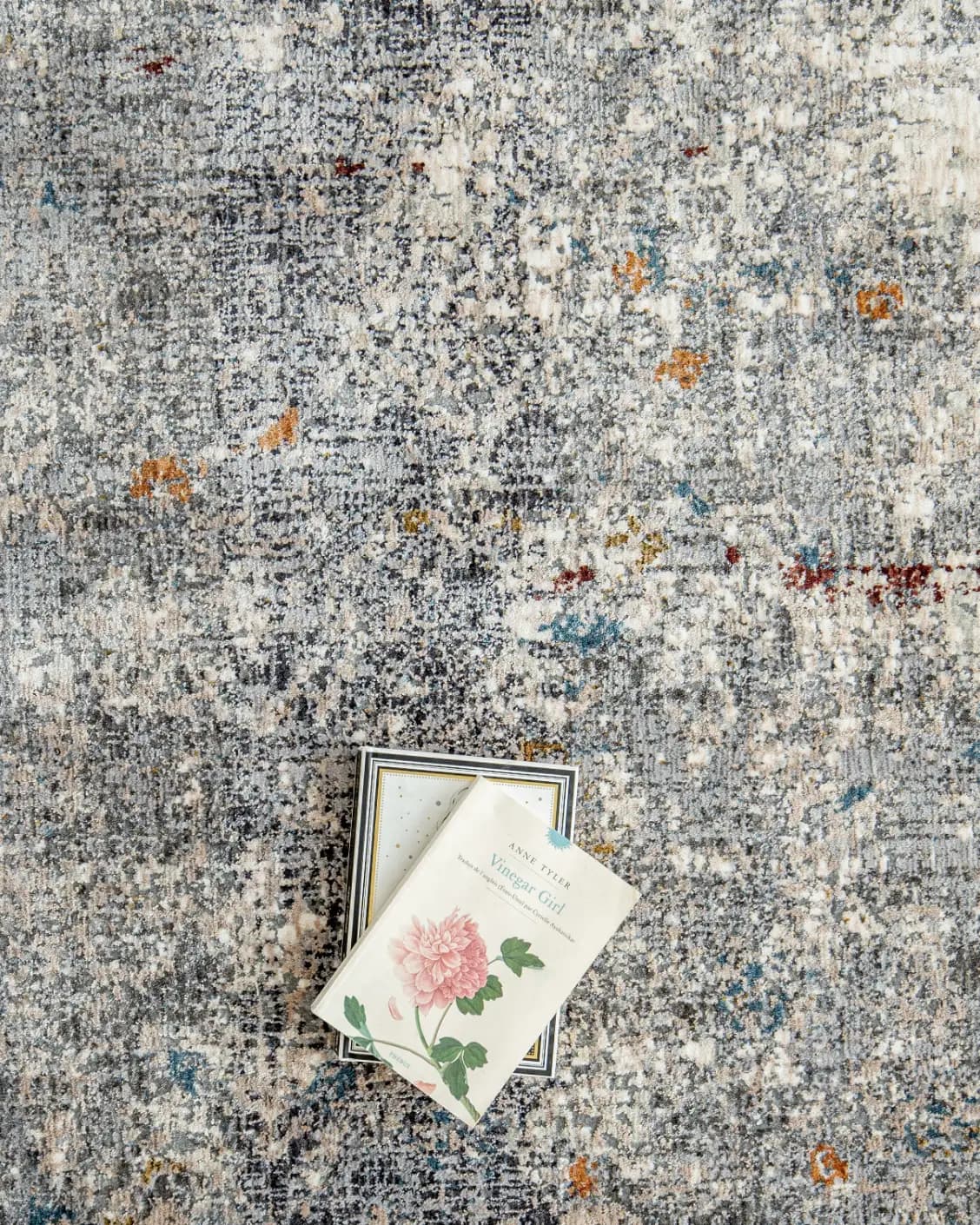 Ethan Ashton carpet in grey and beige, shown in a lifestyle top view as image 8