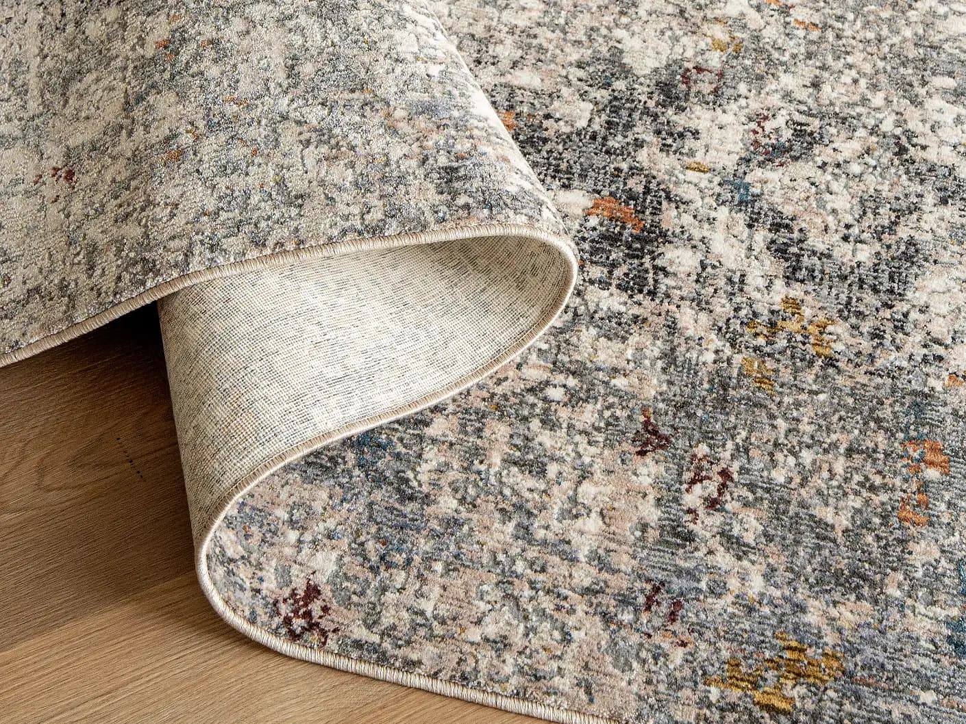Ethan Ashton carpets in grey and beige, shown in a product close-up view
