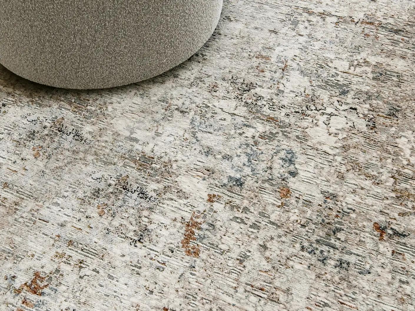 Ethan Brick carpets in gold and grey, shown in a lifestyle close-up as image 2