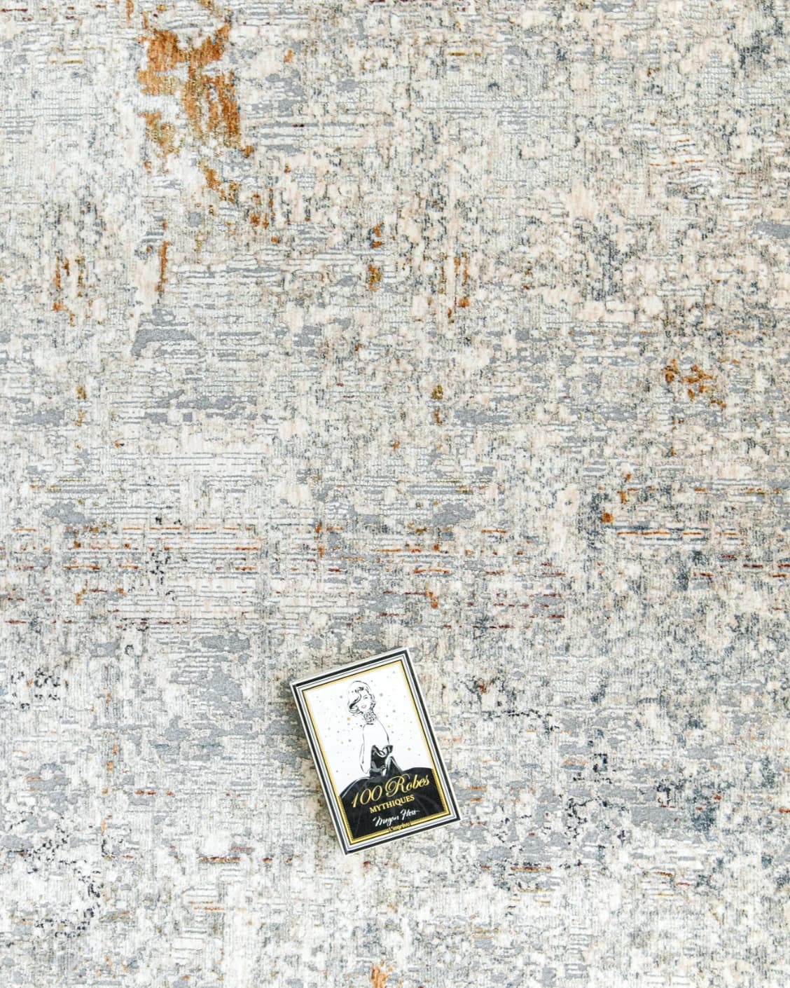Ethan Brick carpet in gold and grey, shown in a lifestyle top view as image 8