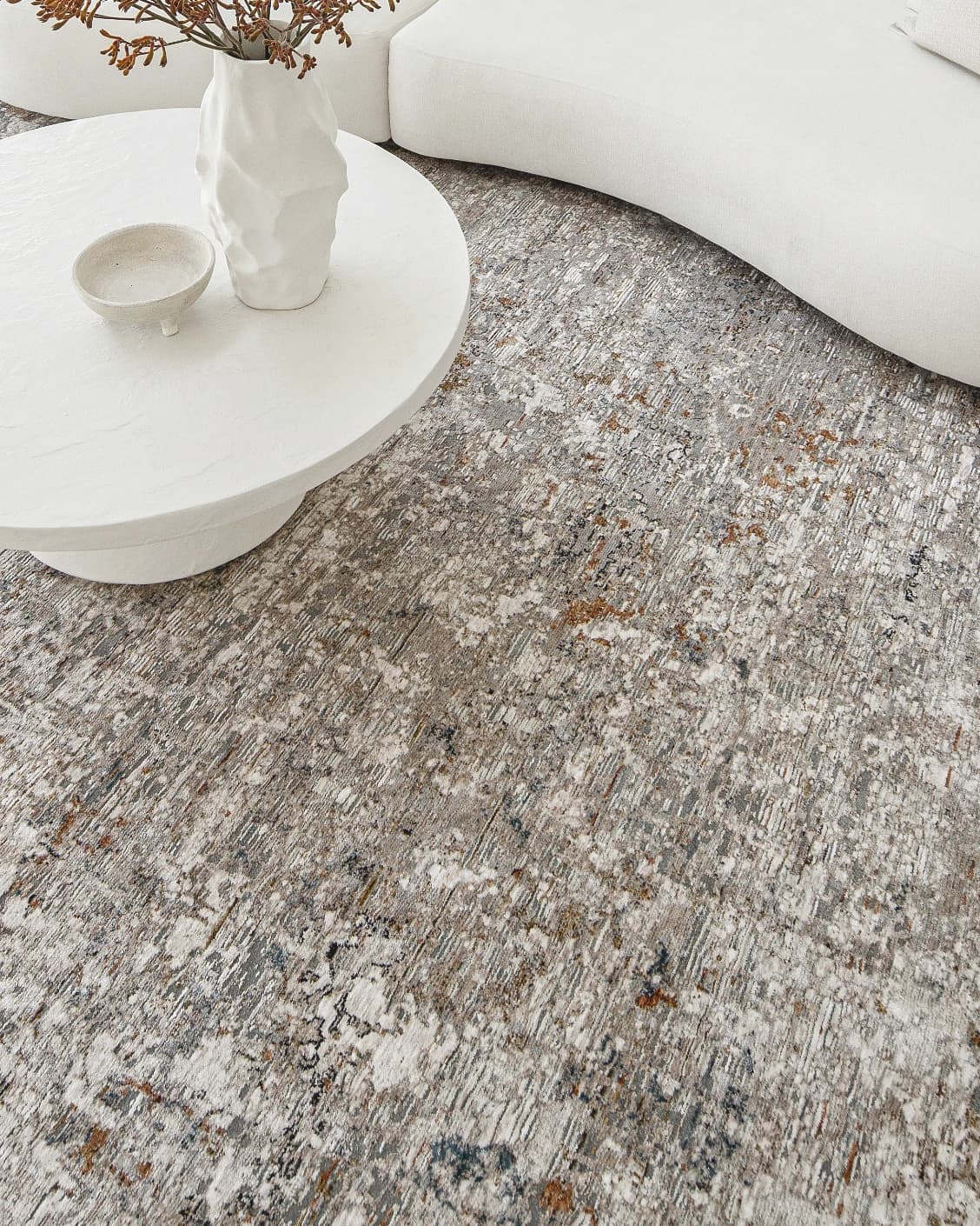 Ethan Brick carpet in gold and grey, shown in a lifestyle top view as image 9