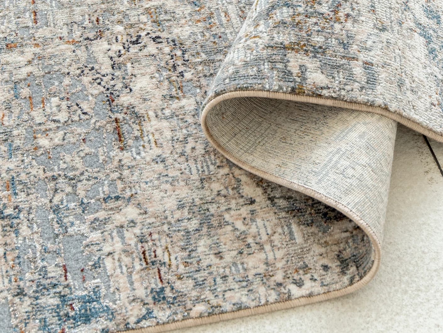 Ethan Brick Runners carpets in gold and grey, shown in a product close-up view