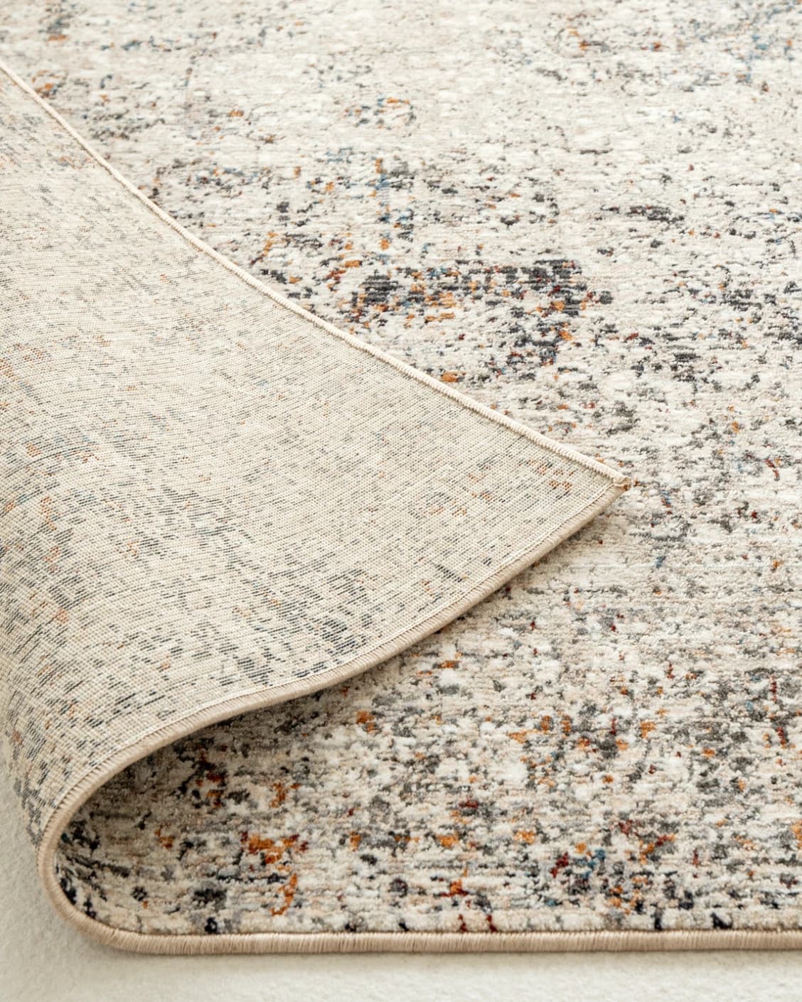 Ethan Dune II carpets in grey, beige and multicolour, shown in a lifestyle close-up as image 2