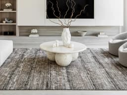 Ethan Ebony carpet in ebony and grey, shown in a lifestyle front view