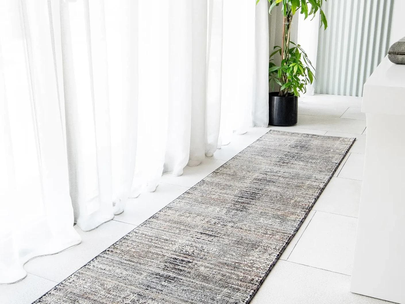 Ethan Ebony carpets in grey, shown in a lifestyle front view as image 1