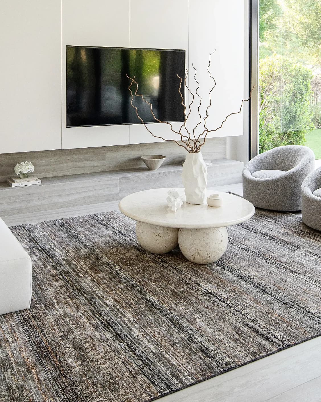 Ethan Ebony carpet in grey, shown in a lifestyle left view as image 7