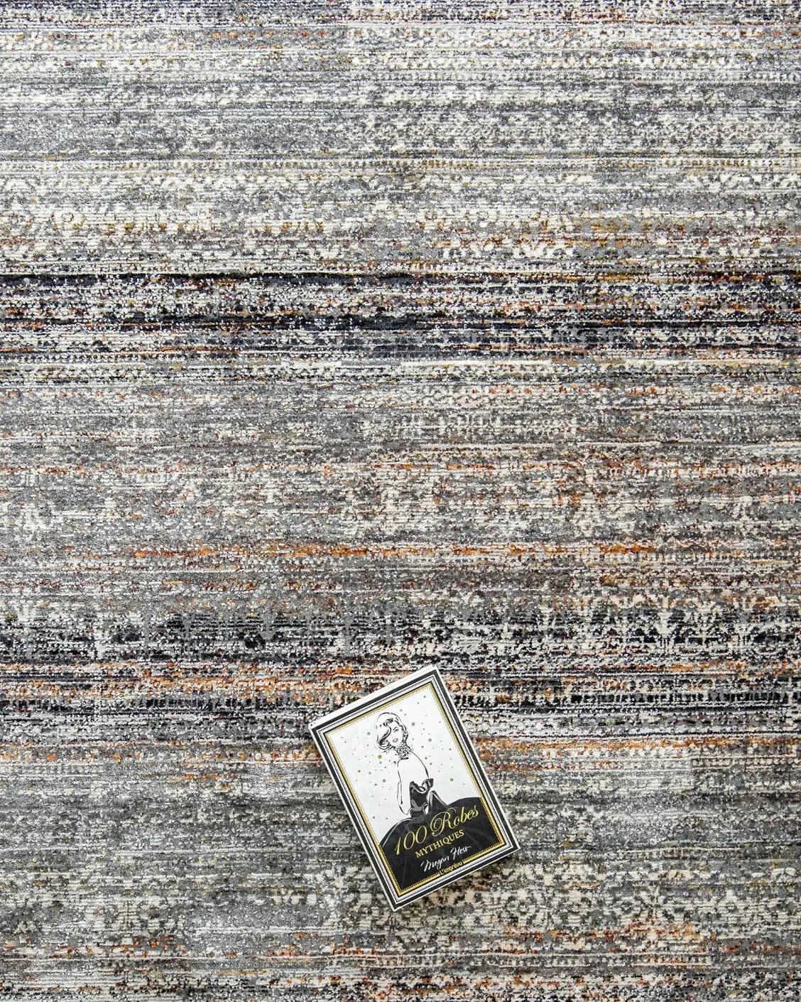 Ethan Ebony carpet in grey, shown in a lifestyle top view as image 9