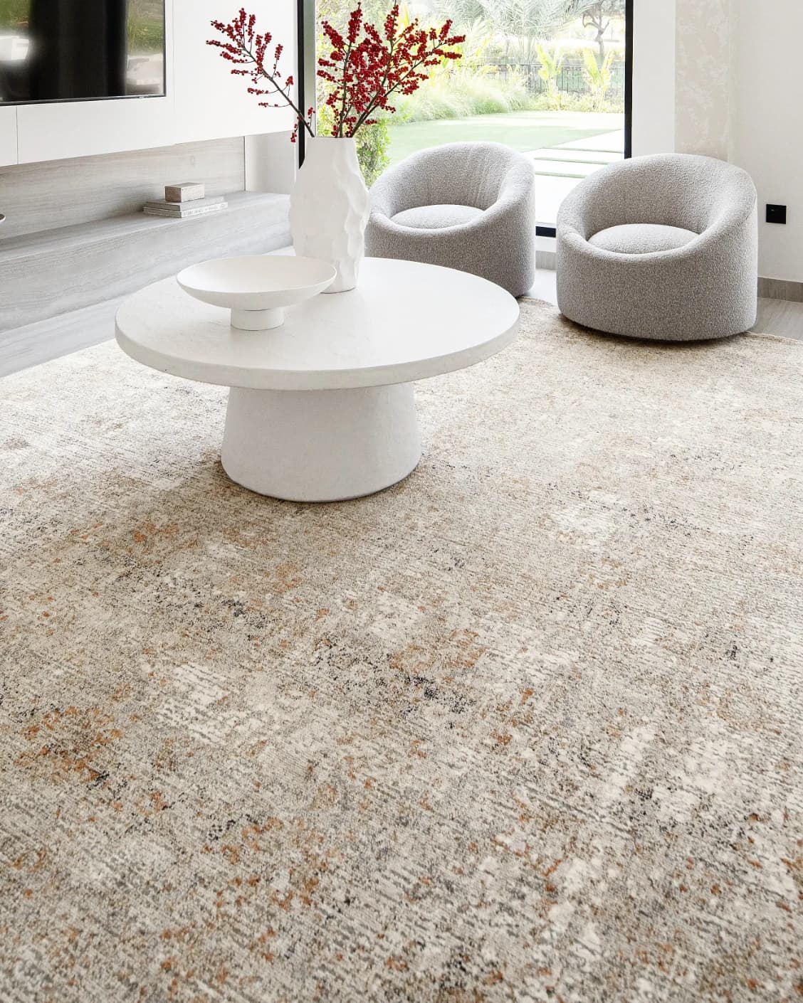 Ethan Goldberg carpet in rust, grey and gold, shown in a lifestyle close-up as image 4