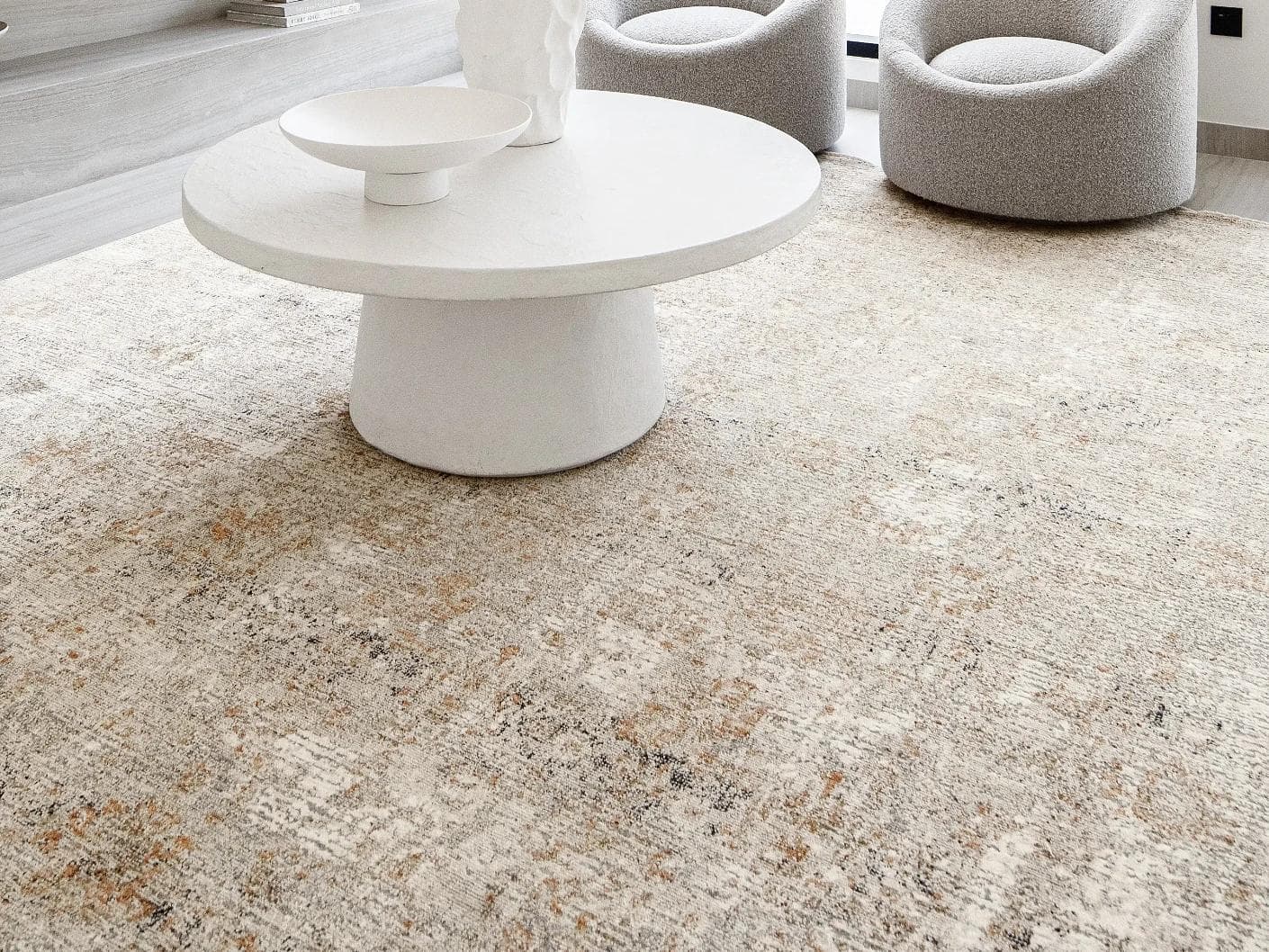 Ethan Goldberg carpet in rust, grey and gold, shown in a lifestyle close-up as image 4