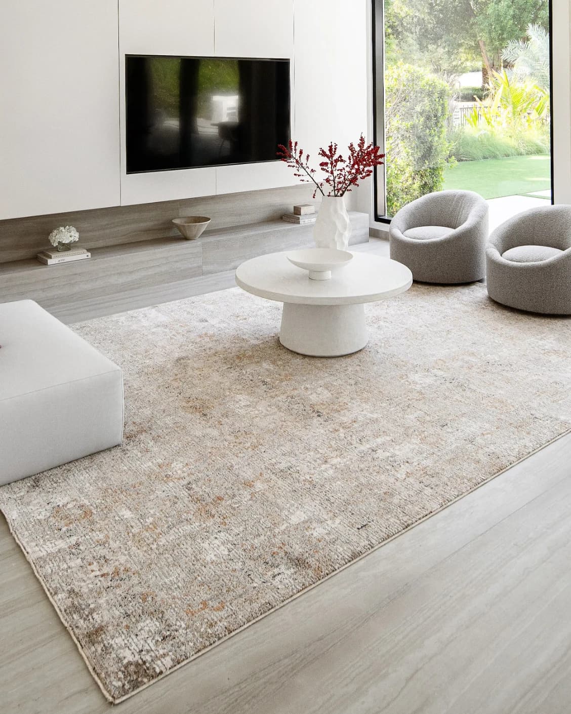 Ethan Goldberg carpet in rust, grey and gold, shown in a lifestyle left view as image 7