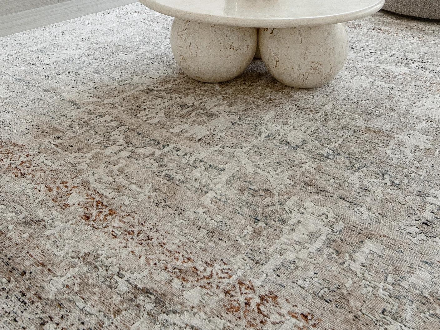 Ethan Martin carpet in beige and grey, shown in a lifestyle close-up as image 4