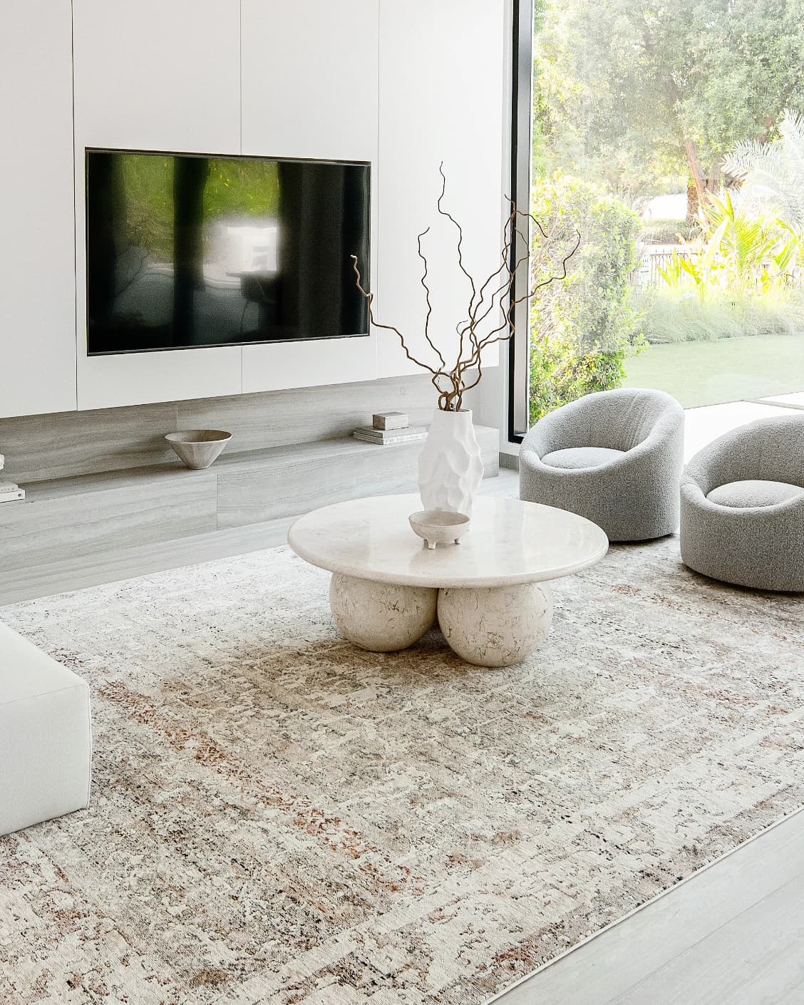 Ethan Martin carpet in beige and grey, shown in a lifestyle left view as image 7