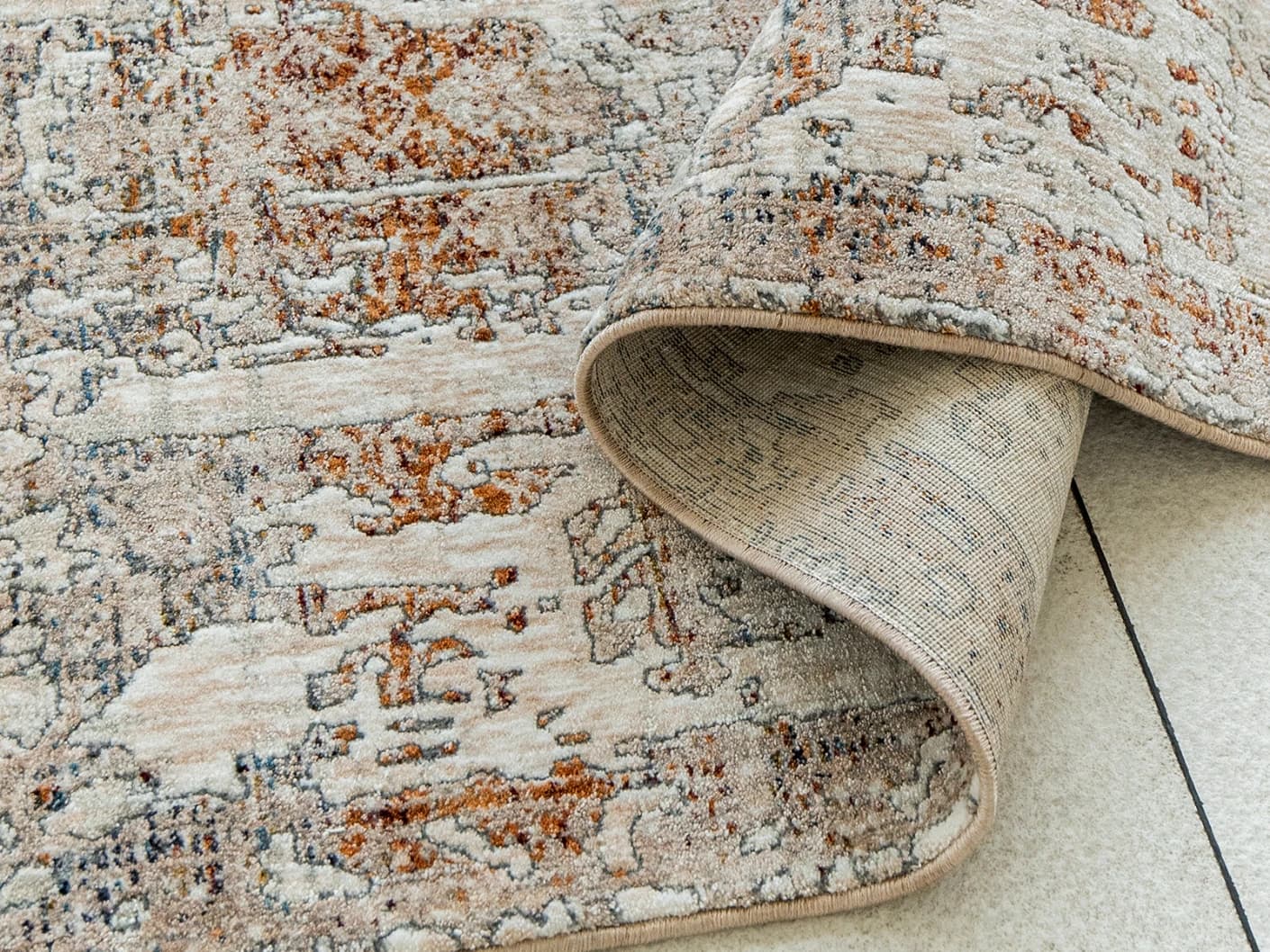 Ethan Martin Runners carpets in beige and grey, shown in a product close-up view