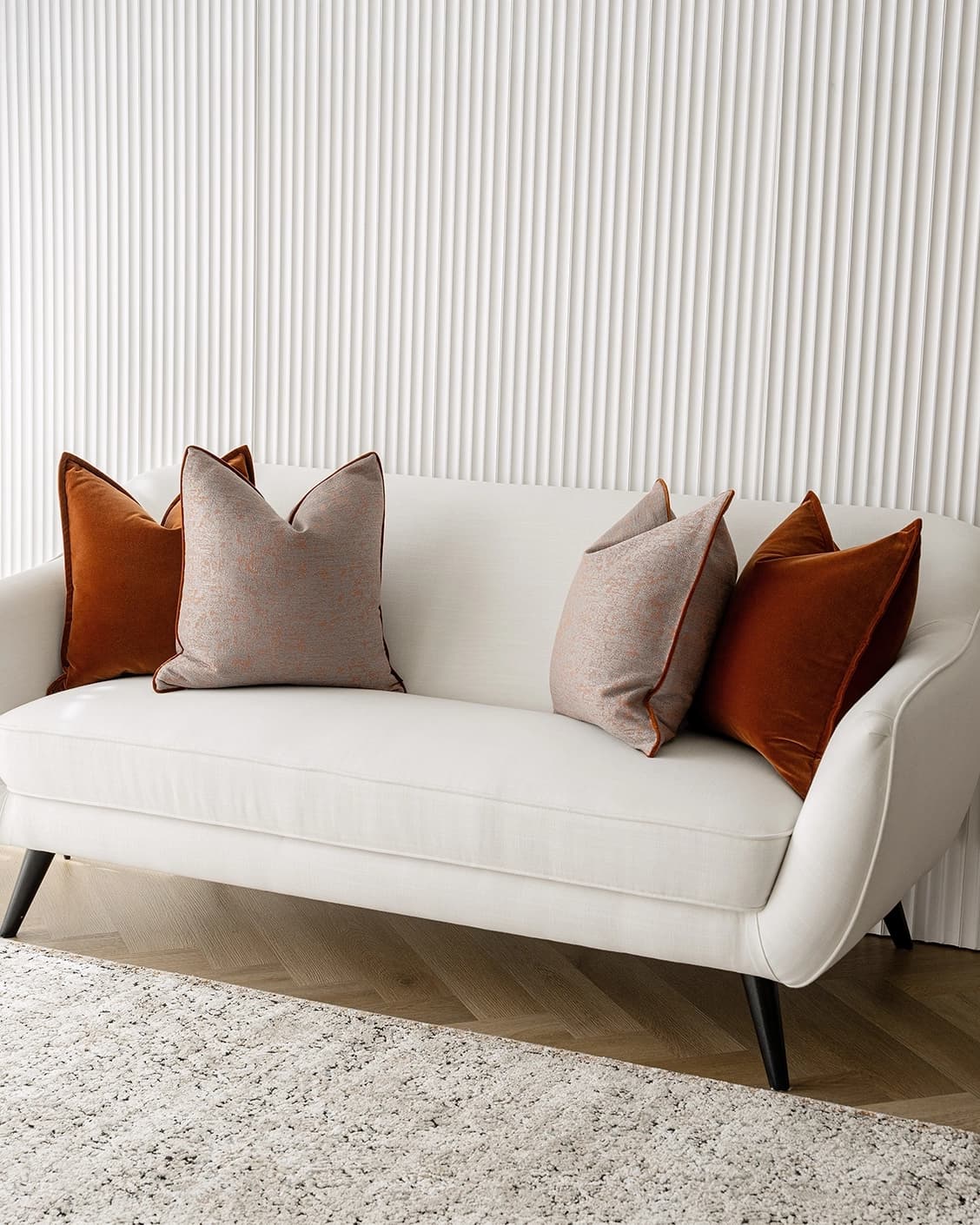 Evander Bundle cushion in rust, shown in a lifestyle right view as image 2