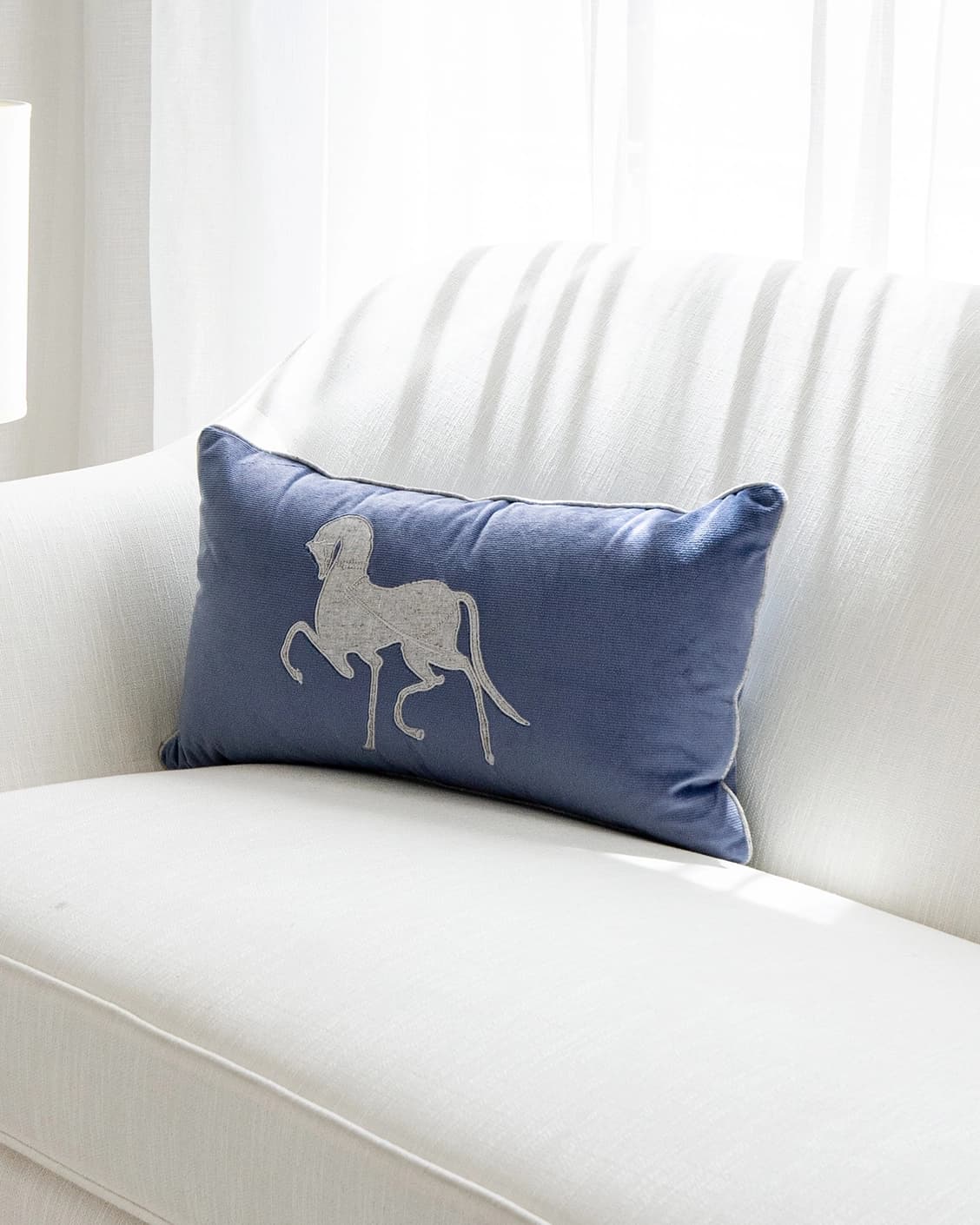 Faaris Matisse cushion in blue and silver, shown in a lifestyle right view as image 2