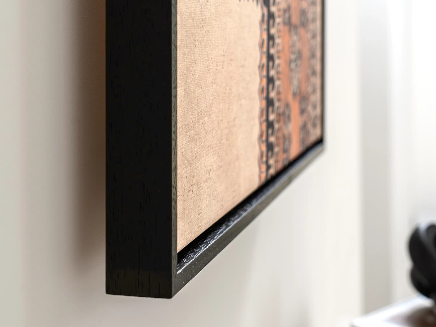 Feather Weight canvas in beige, blue and rust, shown in a lifestyle close-up as image 1