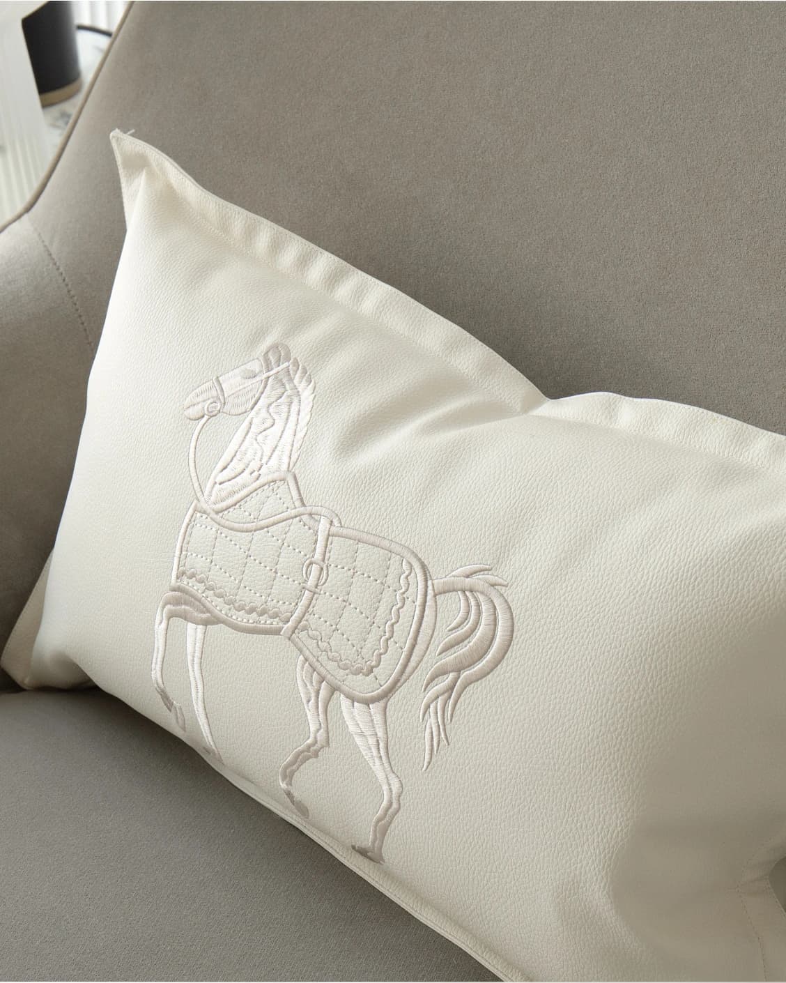 Filip Caravaggio cushion in white, shown in a lifestyle top view as image 5