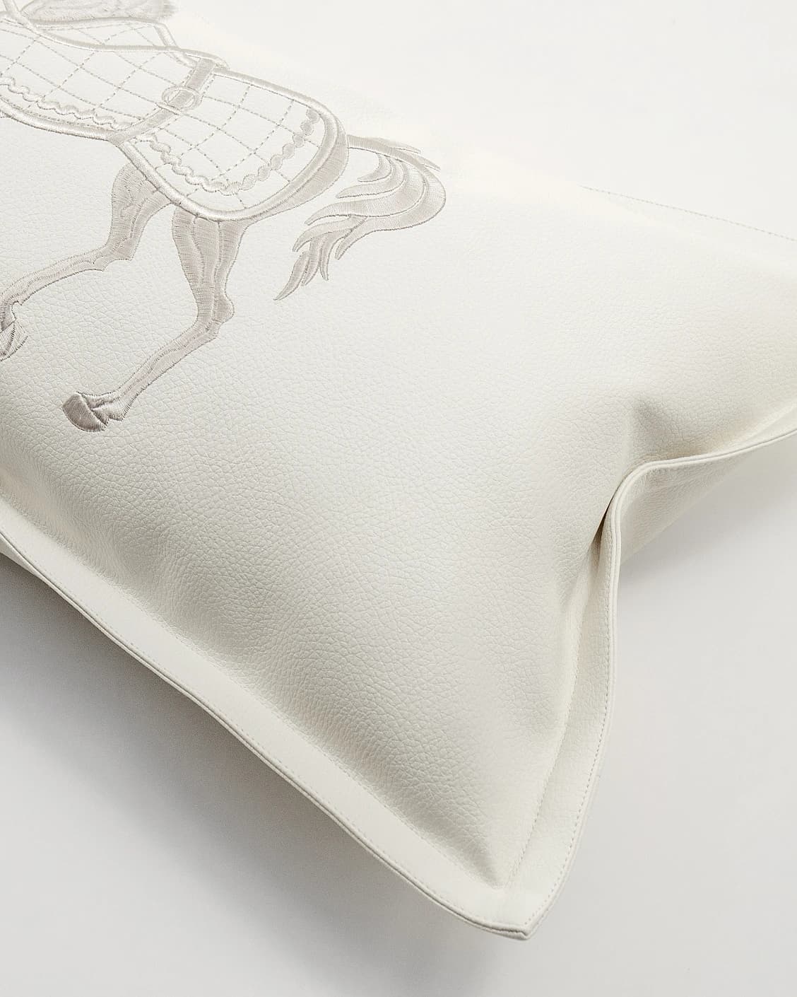 Filip Caravaggio cushion in white, shown in a product top view as image 2