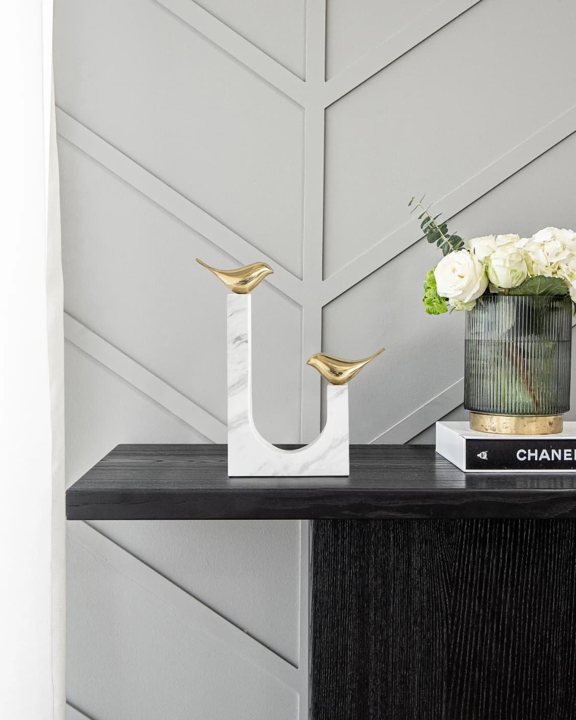 Finch Butterfield statues and sculptures in white and gold, shown in a lifestyle front view as image 2