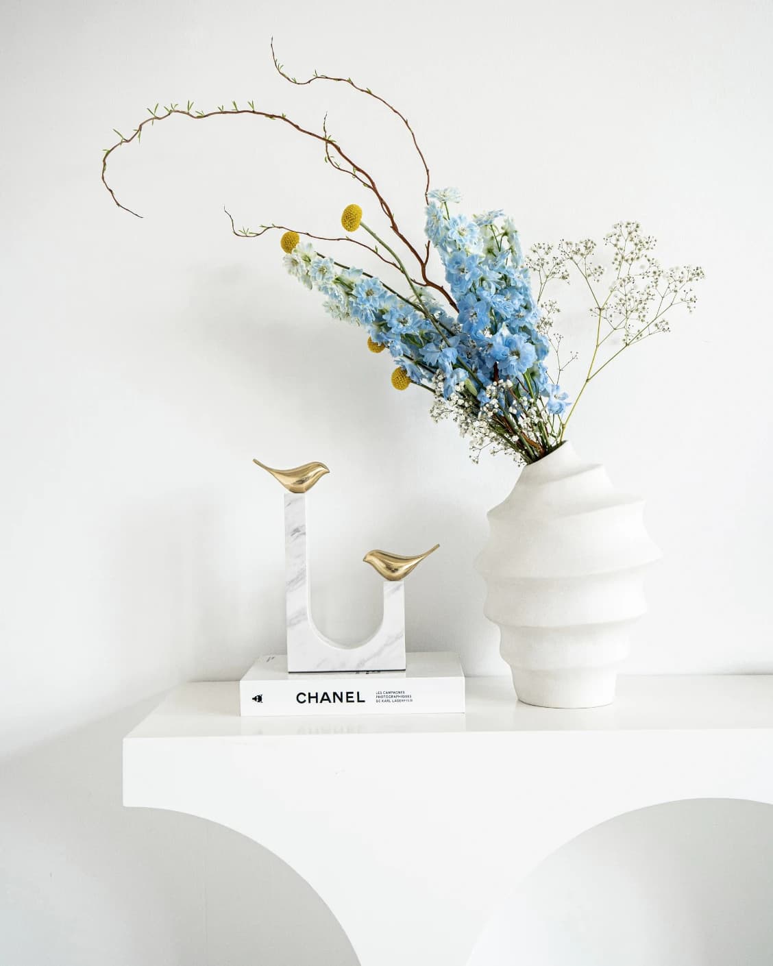 Finch Butterfield statues and sculptures in white and gold, shown in a lifestyle front view as image 3