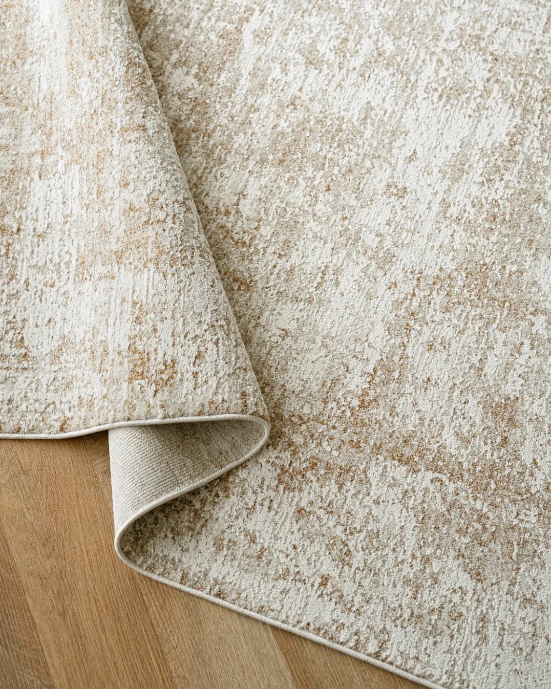 Finley Rust carpet in beige, shown in a lifestyle top view as image 11