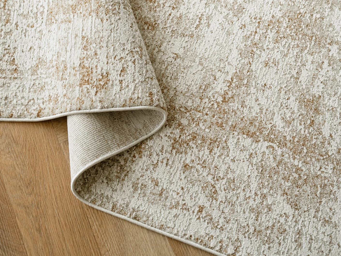 Finley Rust carpets in rust and beige, shown in a lifestyle top view