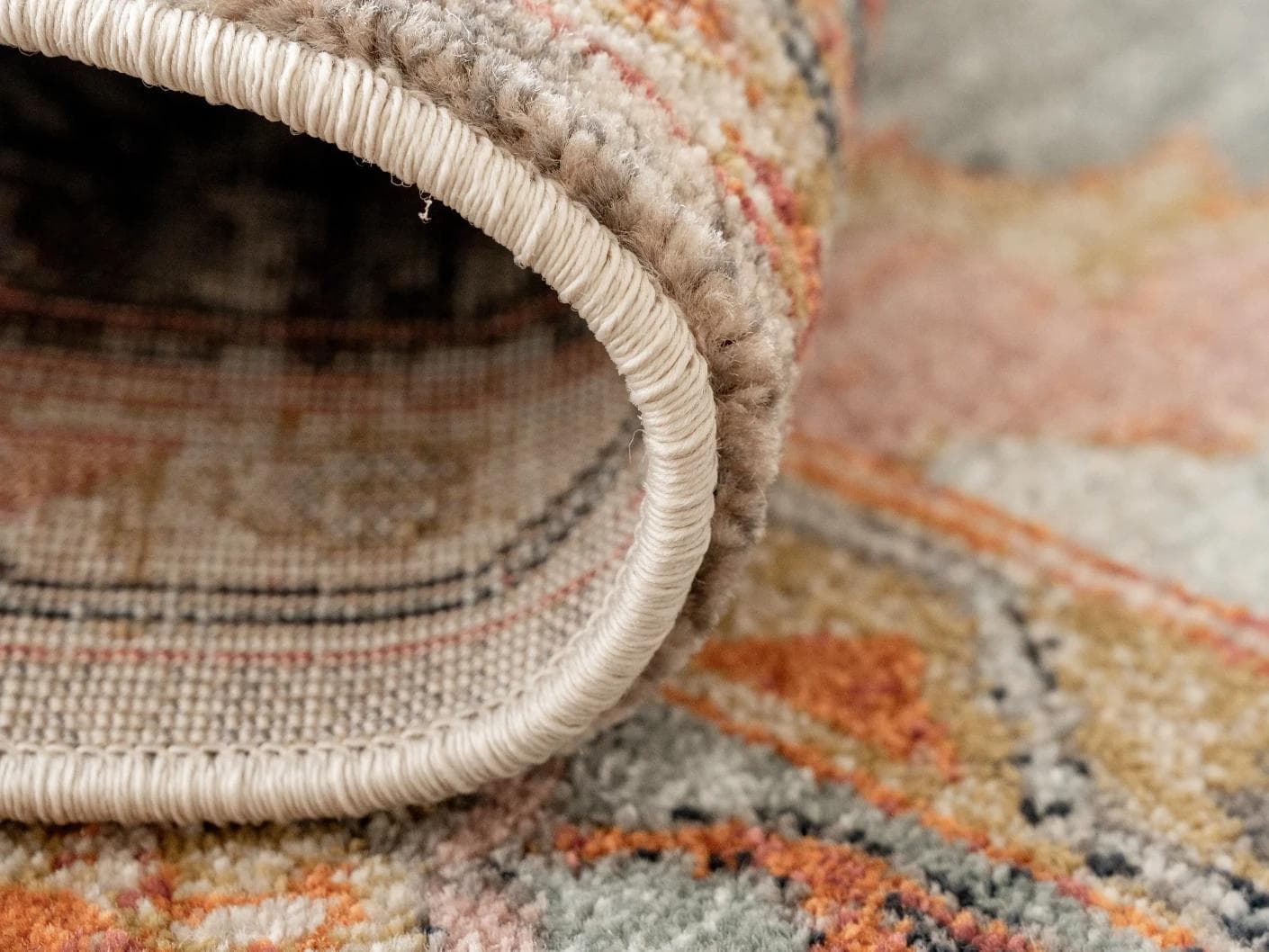 Frank Tiger carpets in blue, orange and multicolour, shown in a product close-up as image 3