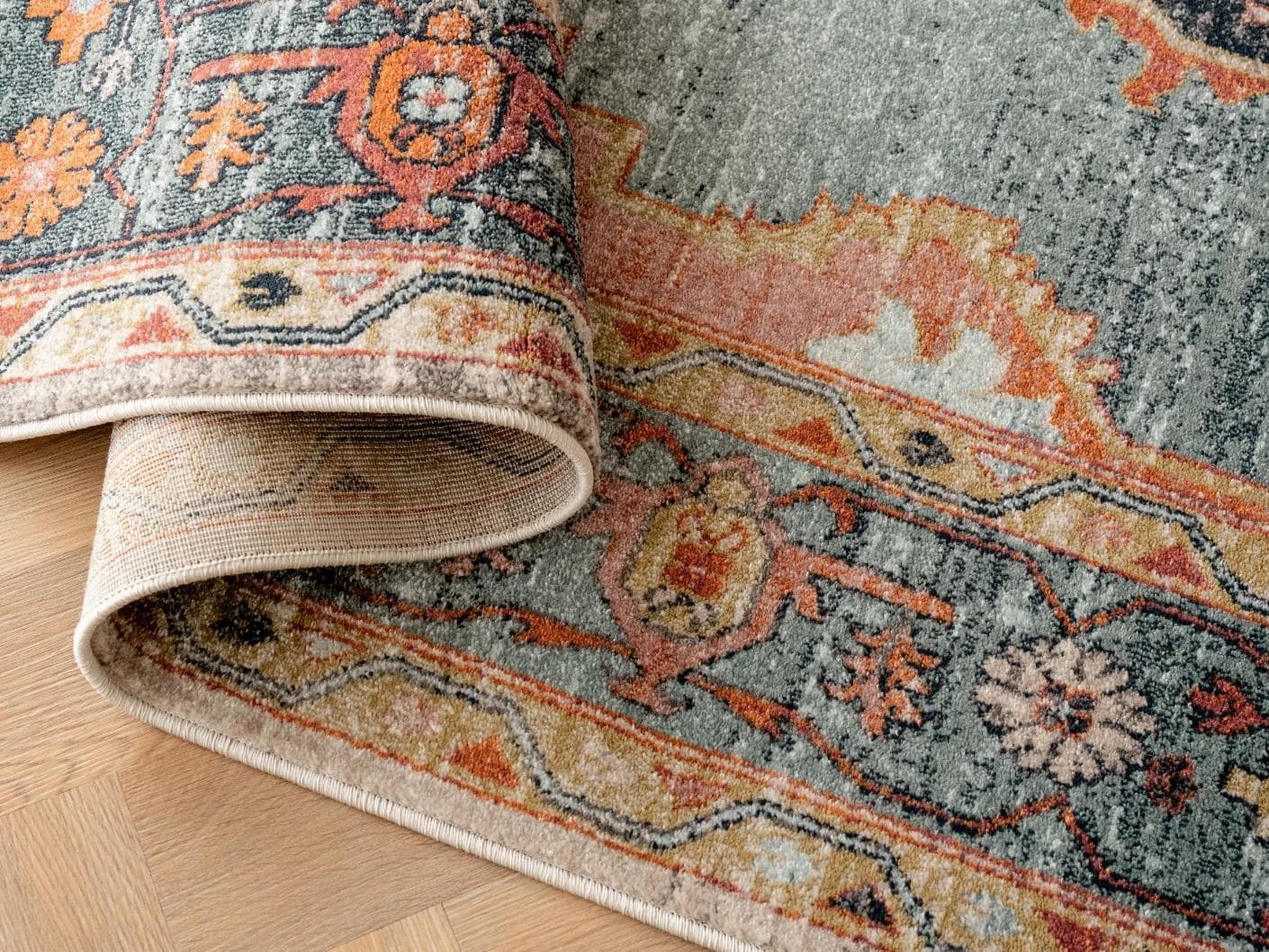 Frank Tiger carpets in blue, orange and multicolour, shown in a product top view as image 1