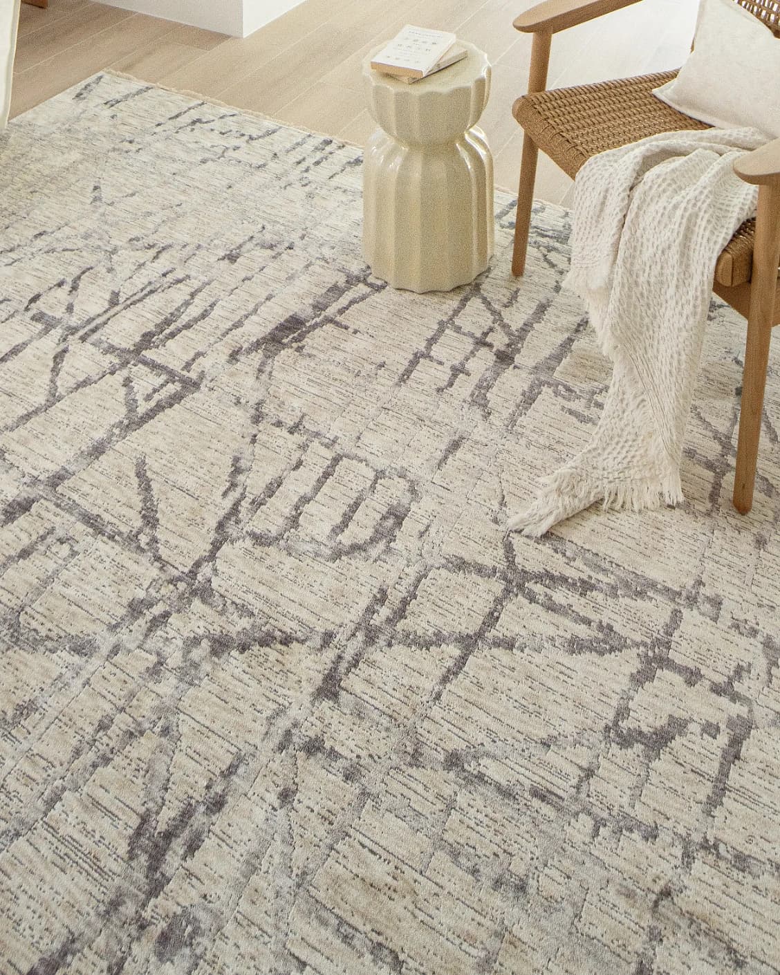Freida Ashley carpet in grey and beige, shown in a lifestyle close-up as image 4