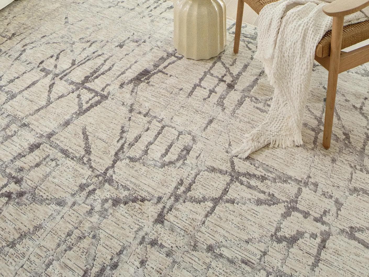 Freida Ashley carpet in grey and beige, shown in a lifestyle close-up as image 4