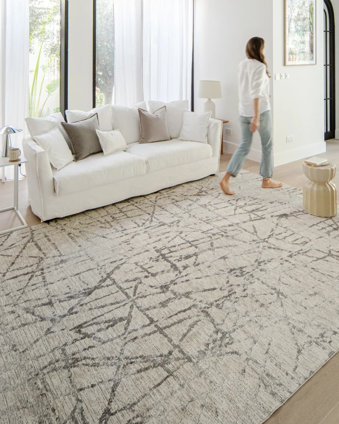Freida Ashley carpet in grey and beige, shown in a lifestyle left view as image 8