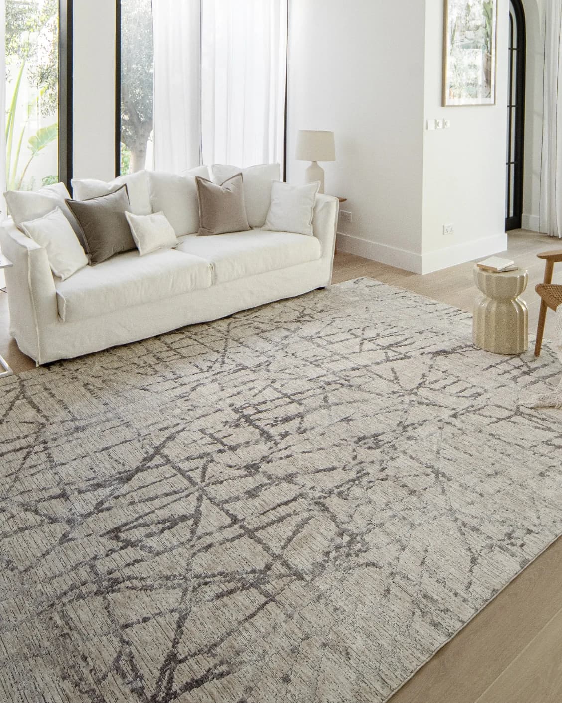 Freida Ashley carpet in grey and beige, shown in a lifestyle left view as image 9