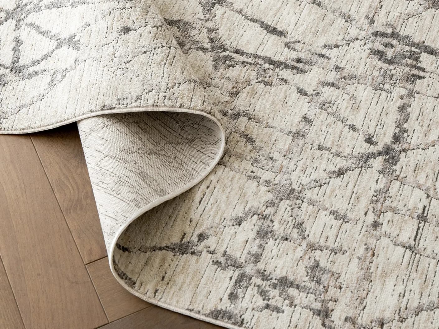 Freida Ashley carpets in grey and beige, shown in a product close-up view