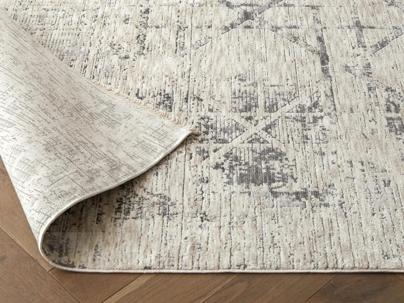 Freida Ashton carpets in grey and beige, shown in a lifestyle close-up as image 2