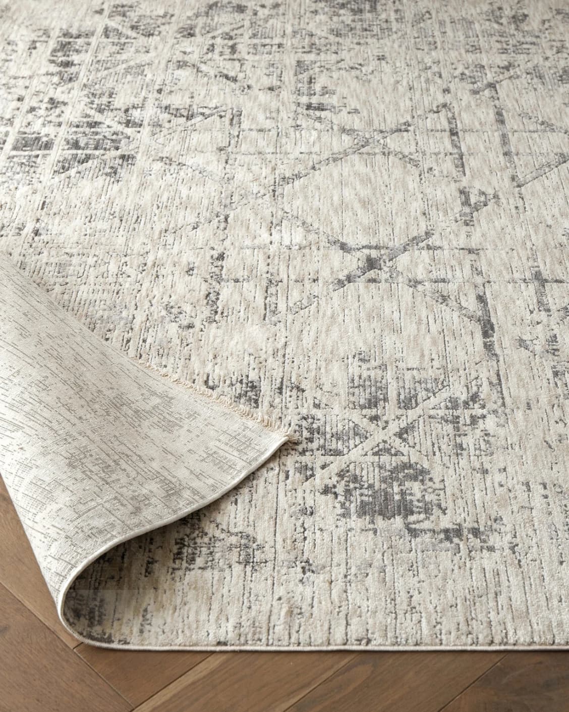 Freida Ashton carpet in grey and beige, shown in a lifestyle front view as image 4
