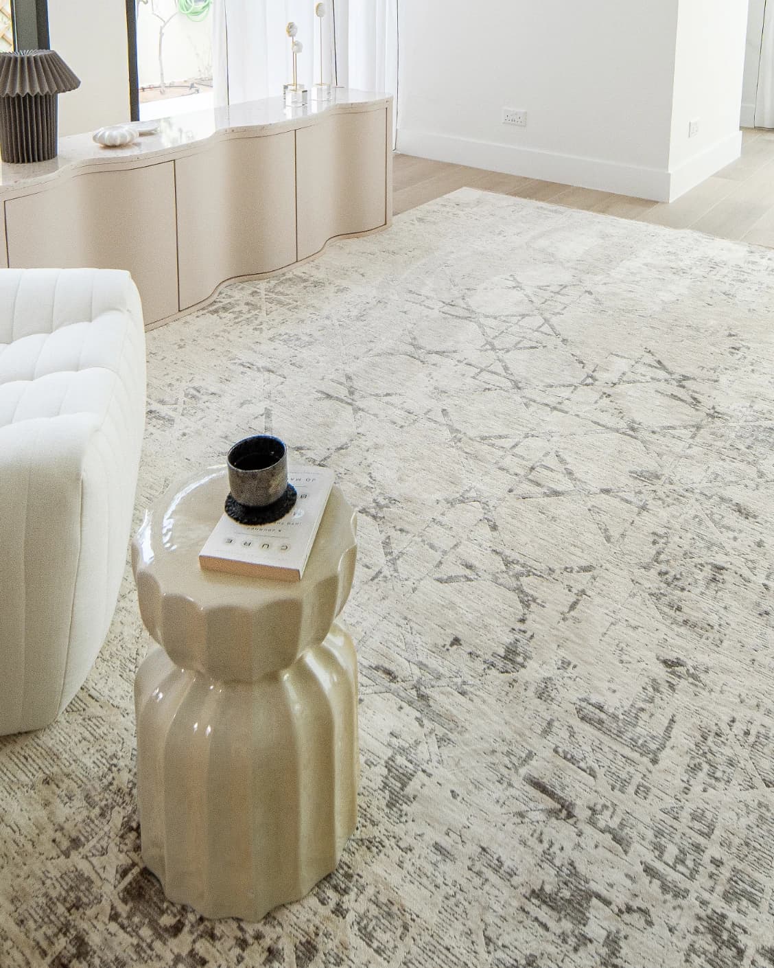 Freida Ashton carpet in grey and beige, shown in a lifestyle left view as image 7