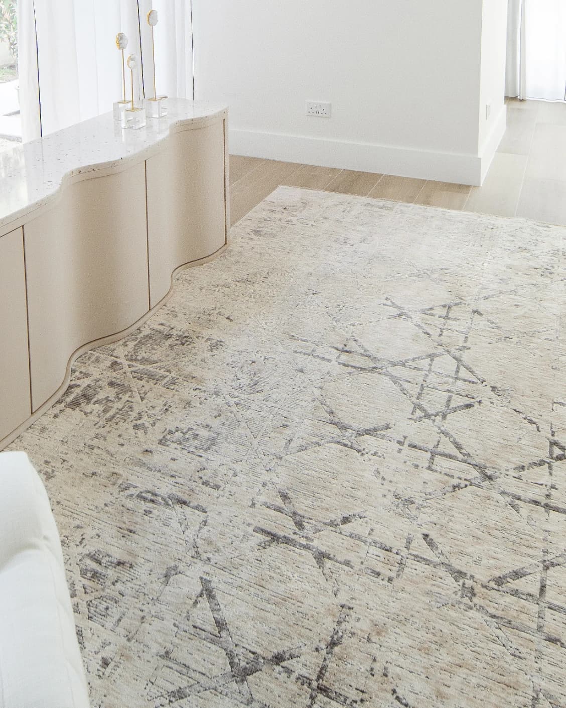Freida Ashton carpet in grey and beige, shown in a lifestyle left view as image 8
