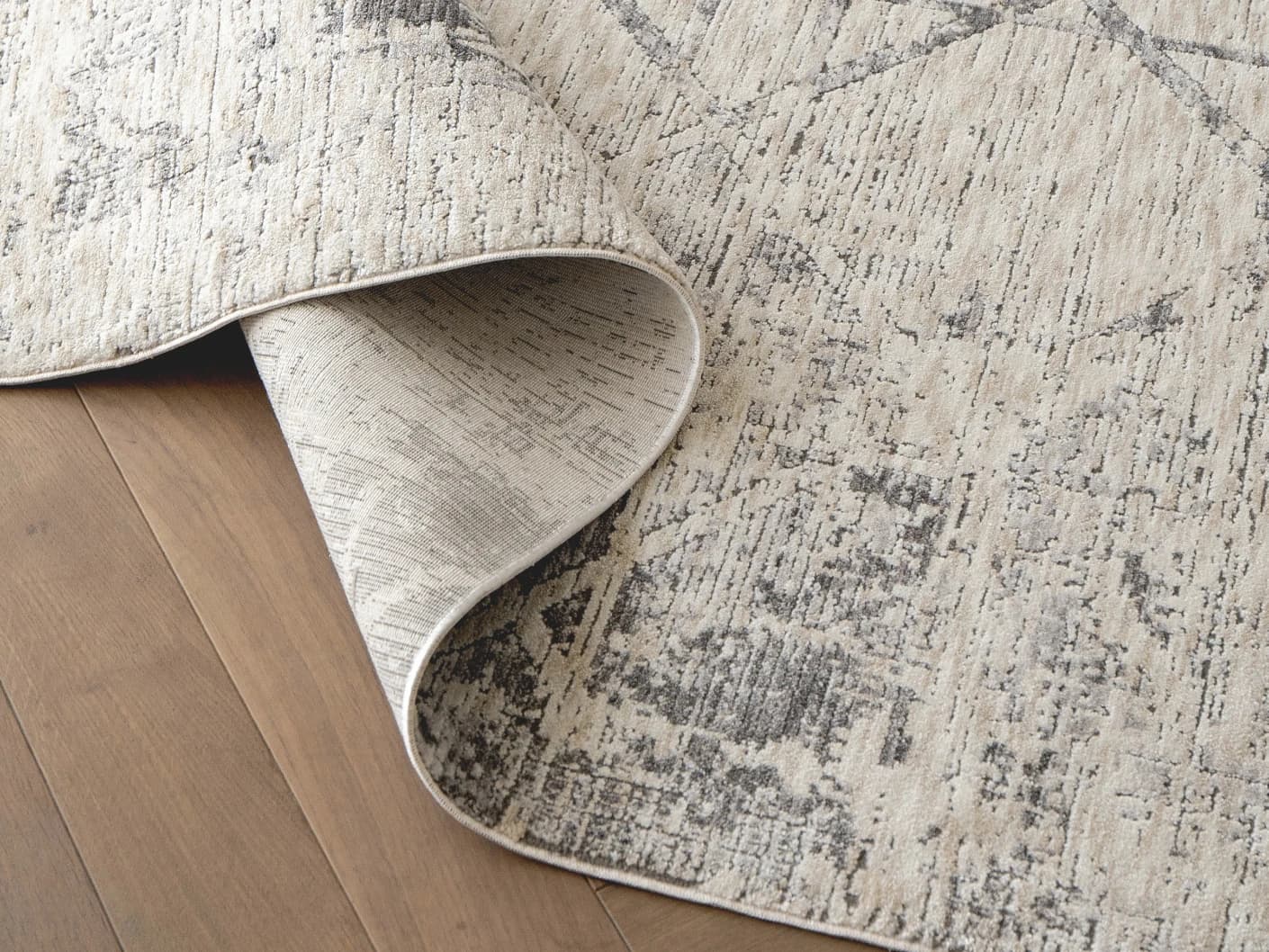 Freida Ashton carpets in grey and beige, shown in a product close-up view