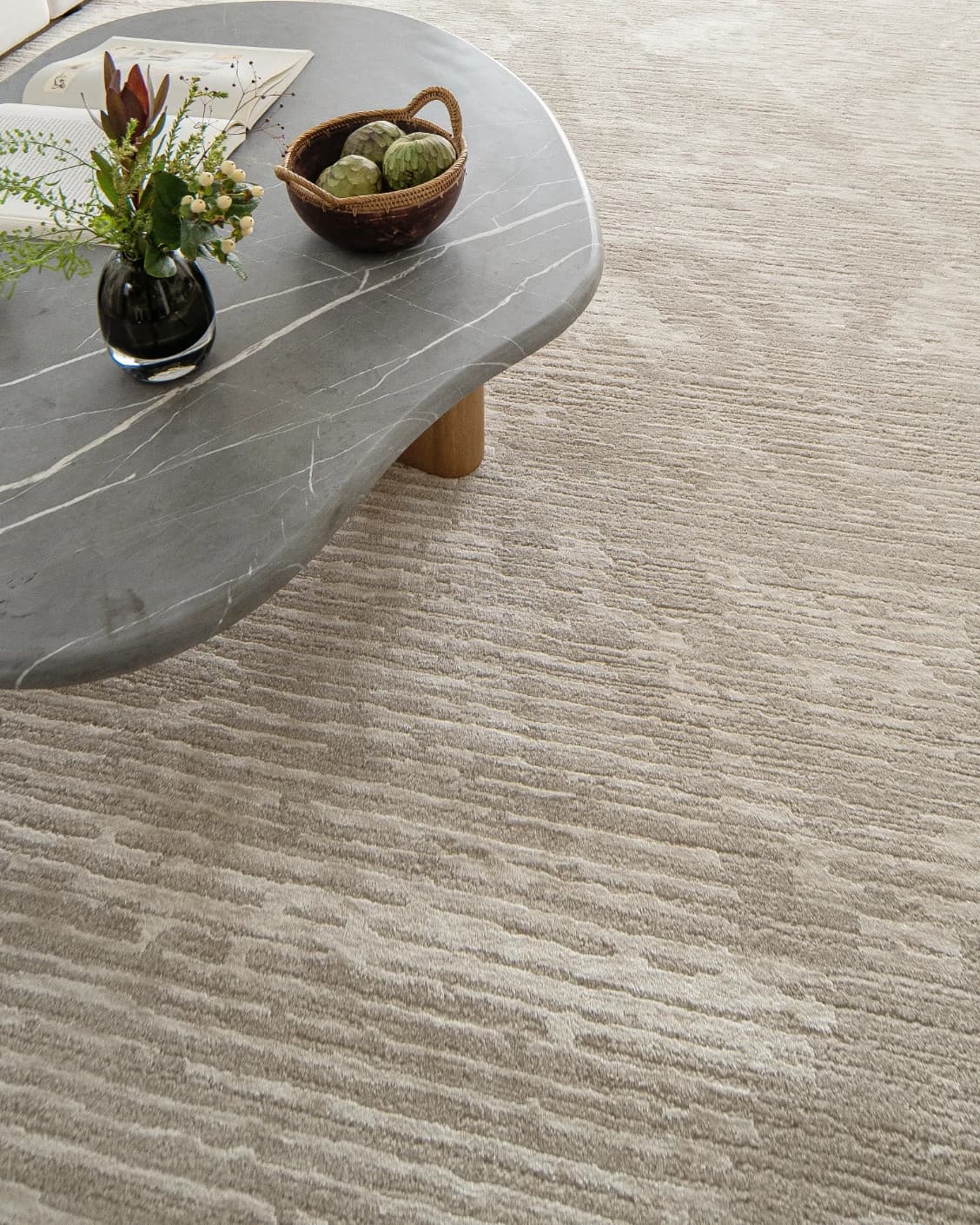 Freida Sandy carpet in beige, shown in a lifestyle top view as image 10