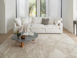 Freida Sandy carpet in sandy and beige, shown in a lifestyle front view