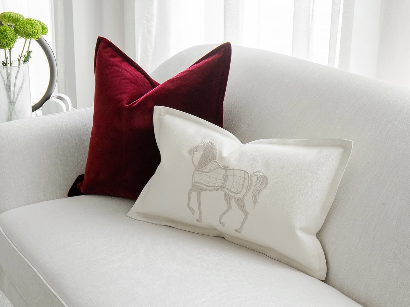 Garnet Bundle bundle cushions in red, shown in a lifestyle front view