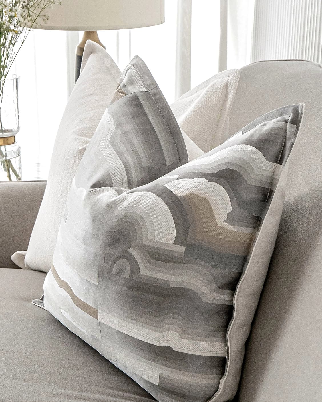 Georgina Bundle cushion in white and grey, shown in a lifestyle close-up as image 8