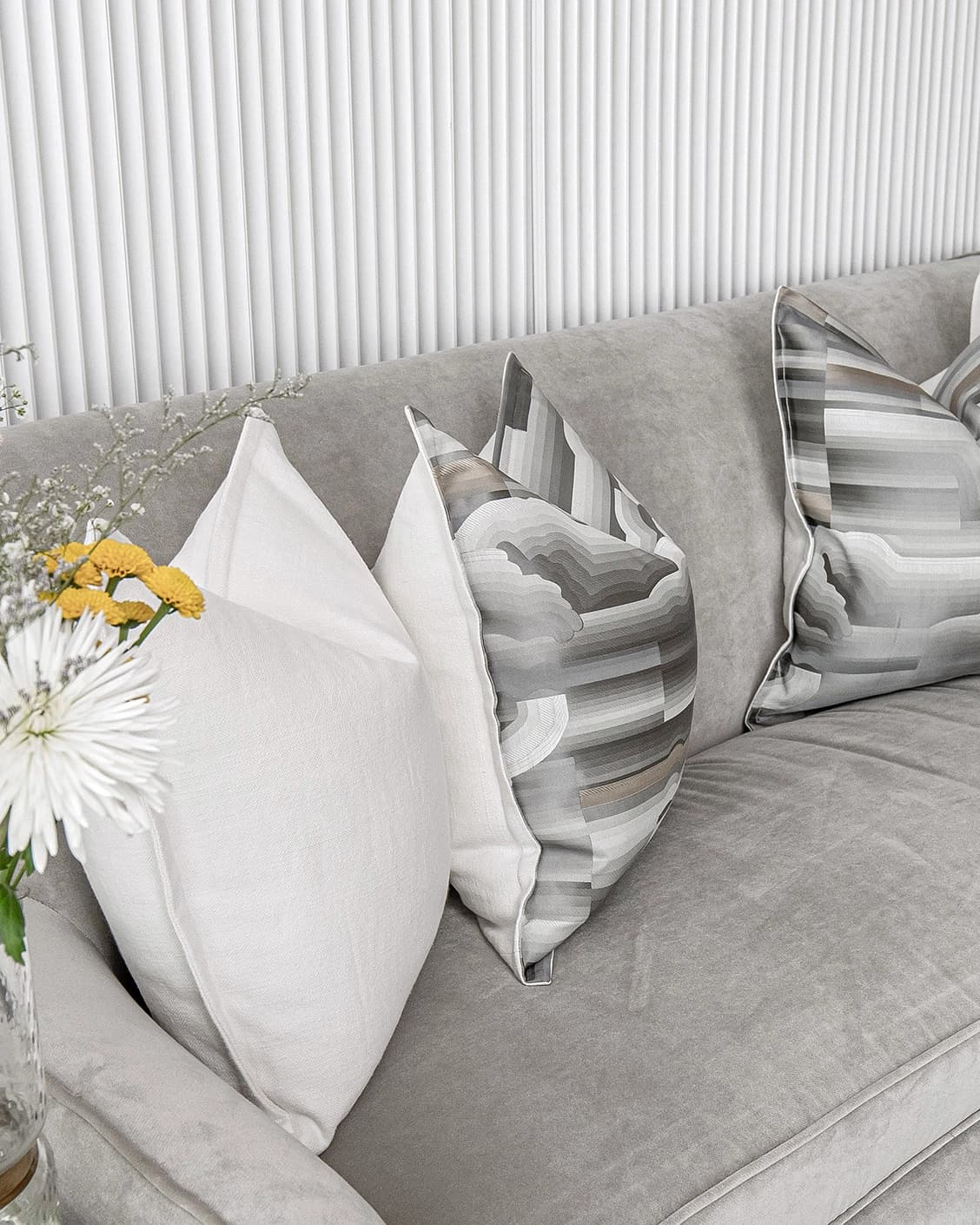 Georgina Bundle cushion in white and grey, shown in a lifestyle left view as image 6
