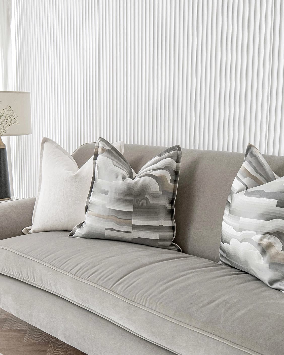 Georgina Bundle cushion in white and grey, shown in a lifestyle right view as image 4