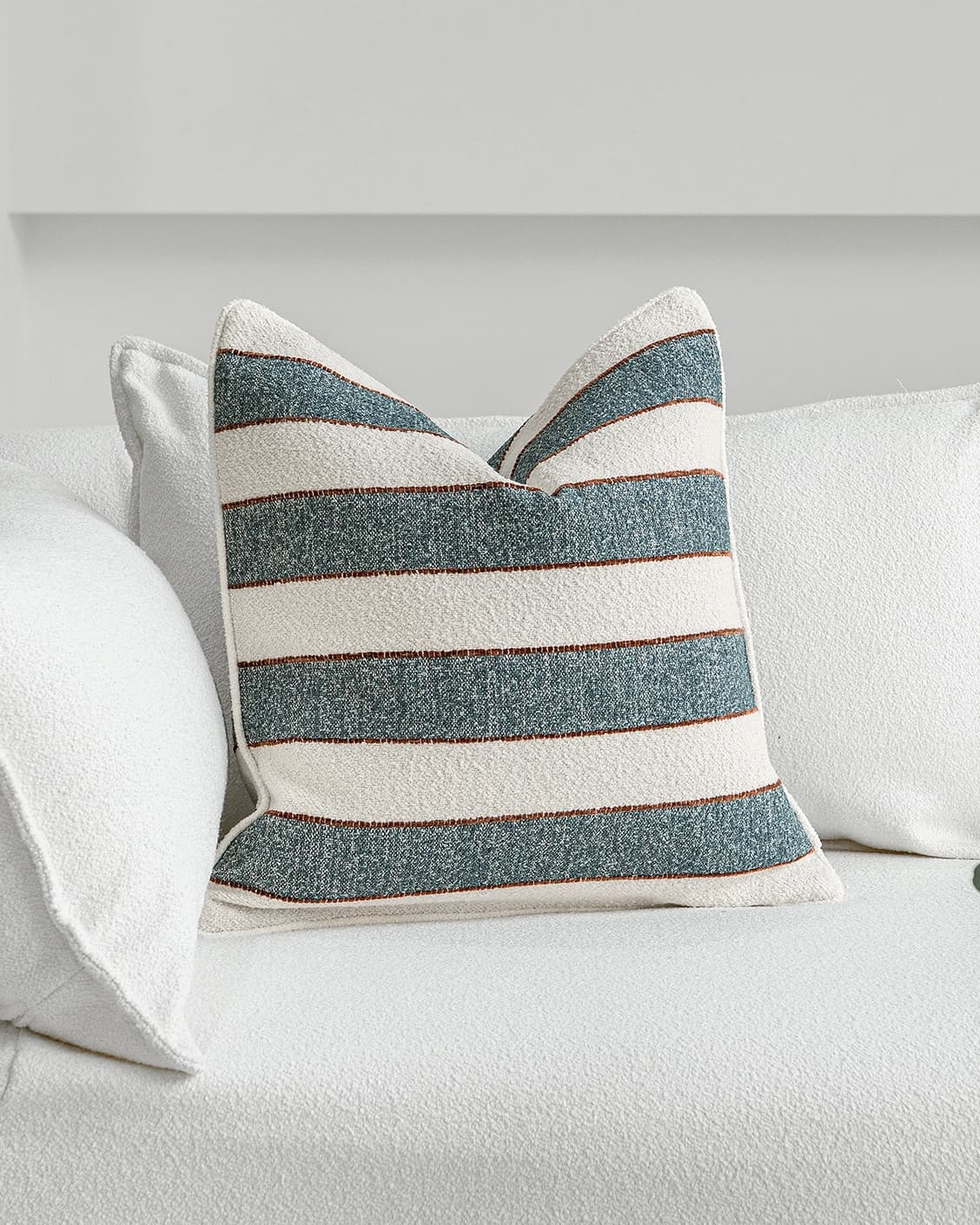 Gia Canova cushion in blue, shown in a lifestyle front view as image 2