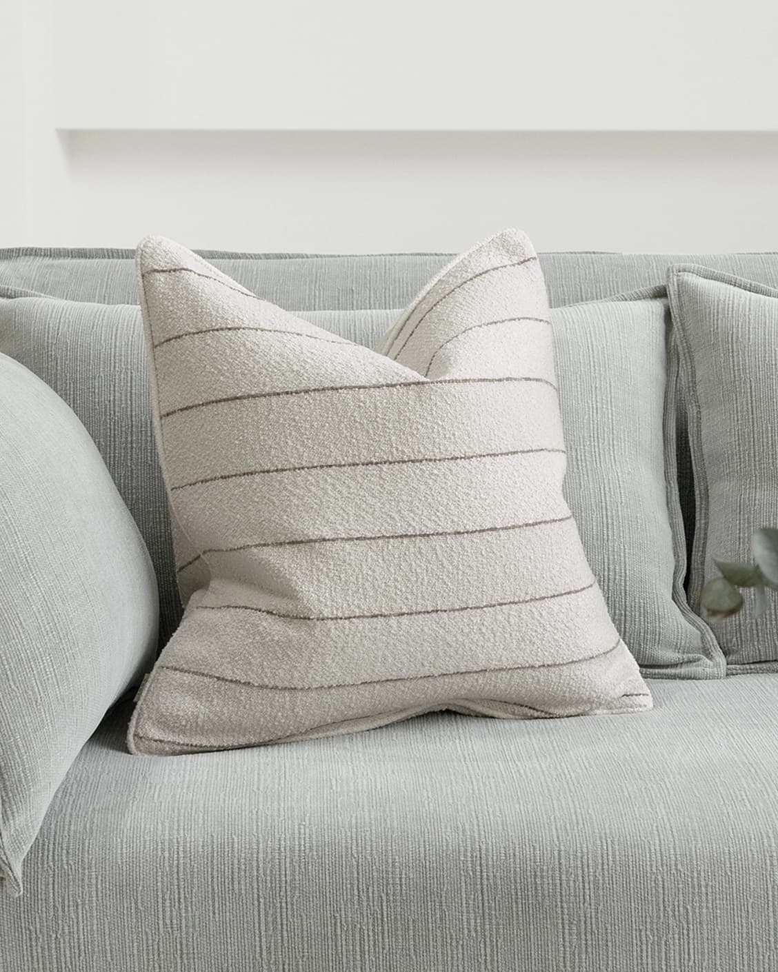Gia Laurent cushion in ivory, shown in a lifestyle front view as image 2