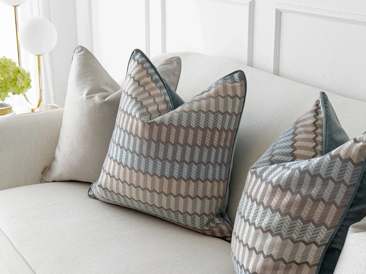 Gina Bundle bundle cushions in silver and blue, shown in a lifestyle front view