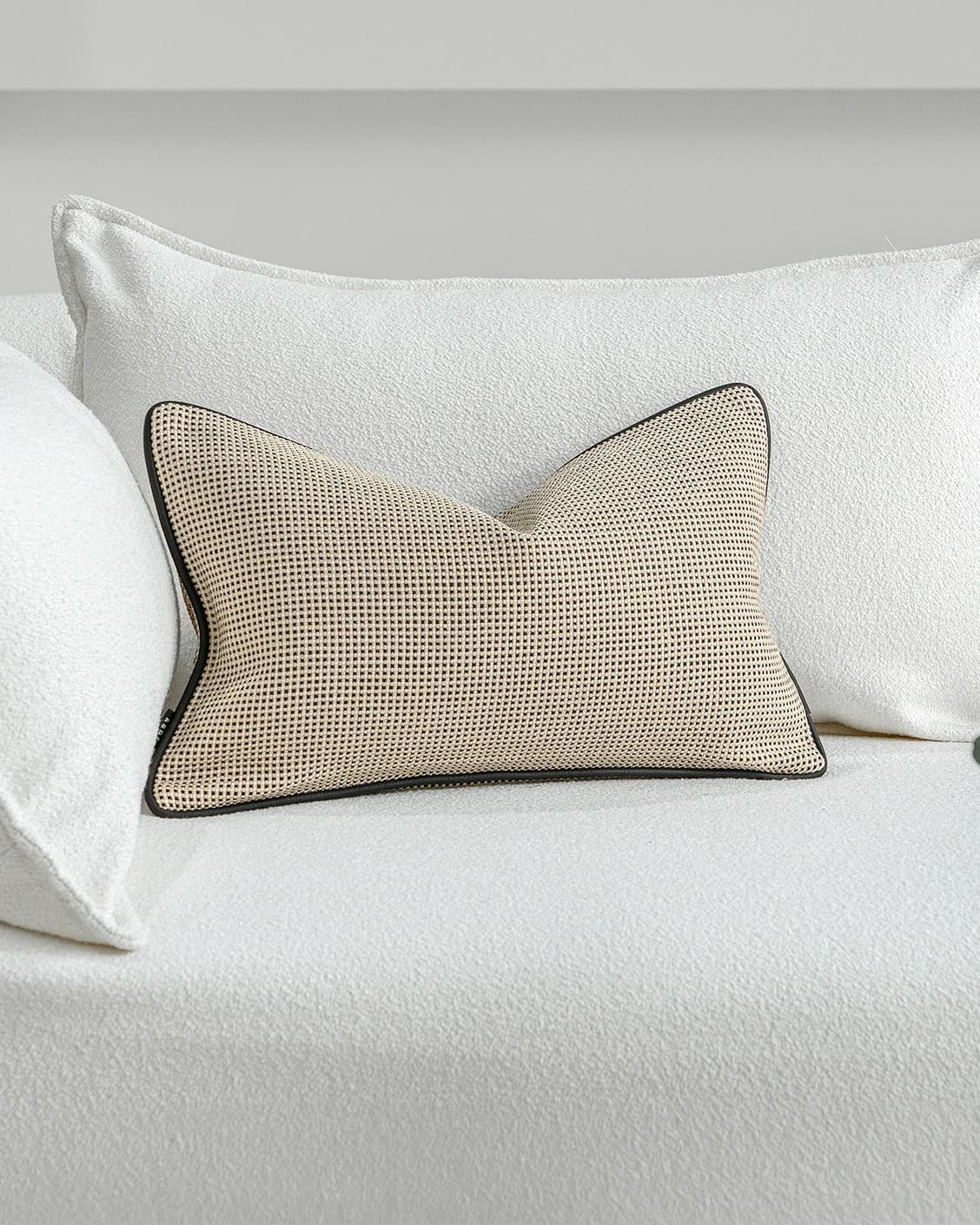 Ginny Laurent II cushion in cream, shown in a lifestyle front view as image 2