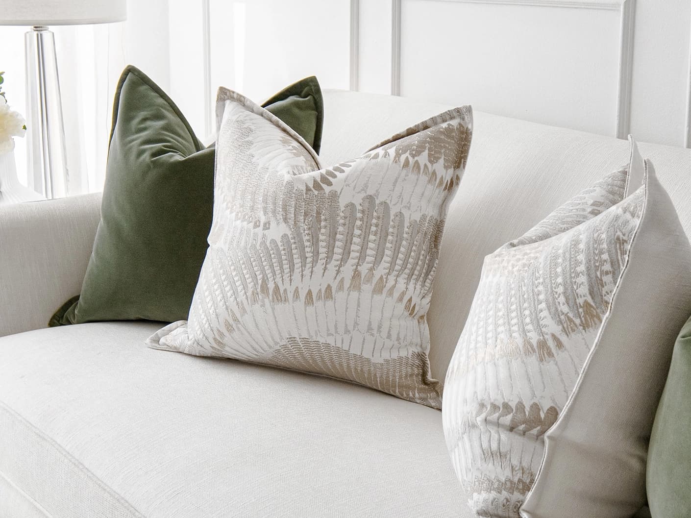 Grace Bundle bundle cushions in green, brown and grey, shown in a lifestyle front view