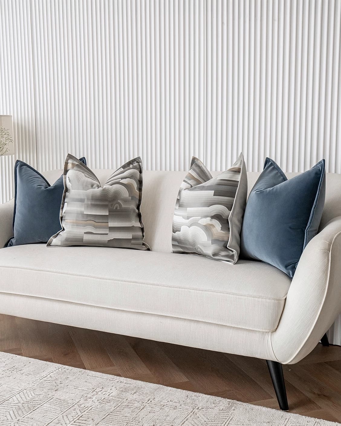 Guadalupe Bundle cushion in blue and grey, shown in a lifestyle right view as image 2
